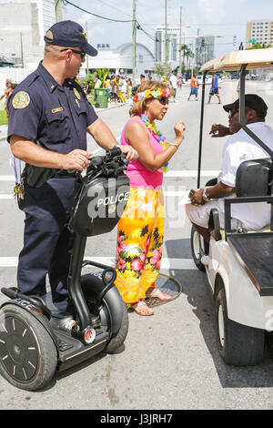Miami Florida,NE Second 2nd Avenue,Miami Caribbean Carnival,costume,festival,festivals,parade,Black man men male,woman female women,police officer,pub Stock Photo