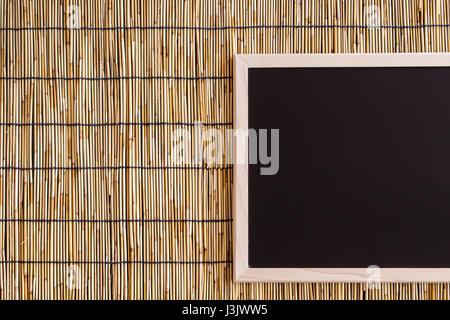 balckboard with bamboo blind background Stock Photo