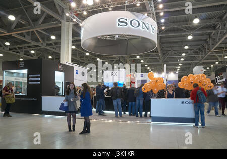 Moscow Crocus Expo, Moscow, Russia - April 20, 2017: Visitors came to Sony stand to try new cameras and lenses at Photoforum 2017 Stock Photo