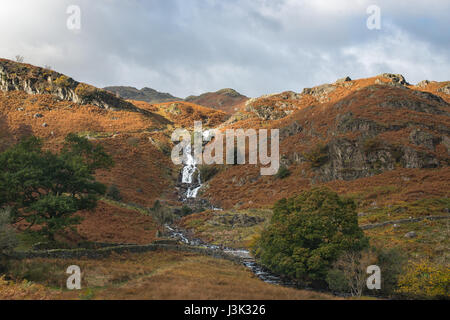 looking over one of the many waterfalls around the lake district from Grasmere, England Stock Photo