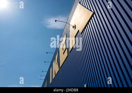 IKEA sign at store against blue sky. Founded in Sweden in 1943 IKEA has been the world's largest furniture retailer since at least 2008. Stock Photo