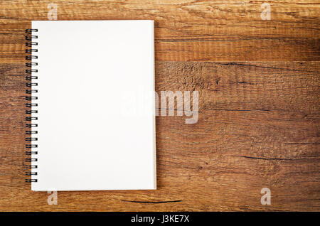 Blank open sketchbook on wooden background. Ready for your text. Stock Photo