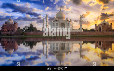 Taj Mahal sunset view from the banks of Yamuna river. Taj Mahal is a white marble mausoleum designated as a UNESCO World heritage site Stock Photo