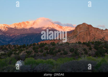 Sunrise image of Pikes Peak Mountain and Garden of the Gods in the springtime with the Rock Ledge Barn in the foreground Stock Photo