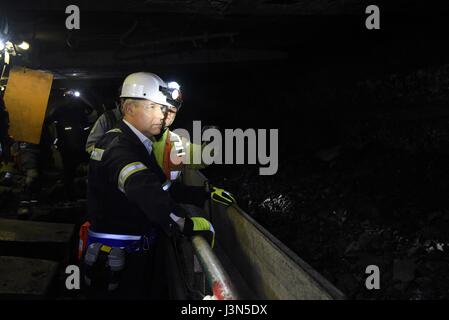 U.S. Environmental Protection Agency Administrator Scott Pruitt watches an underground conveyor belt system carrying coal to the surface during a tour of the Harvey Mine April 13, 2017 in Sycamore, Pennsylvania. Pruitt was visiting the area as part of his Back-to-Basics Agenda promoting coal as a source of energy. Stock Photo