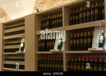 Castello di Meleto, Castle of Meleto, castle from 11th century, board with bottles of red wine, Chianti, Massellone Valley, Gaiole In Chianti, Siena, Tuscany, Italy, Europe Stock Photo