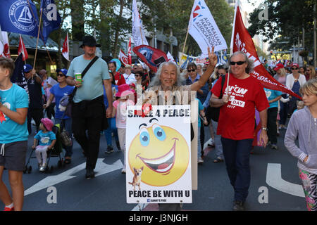 Sydney, Australia. 7th May, 2017. The annual May Day March started at Hyde Park North from 12pm with speeches. Protesters then marched down to Prince Alfred Park for food, live music and entertainment. This year the theme for May Day was fighting inequality, with a focus on workers' rights. Pictured: Eccentric, Sydney personality, Danny Lim and his dog Smarty take part in the march. Credit: Credit: Richard Milnes/Alamy Live News Stock Photo