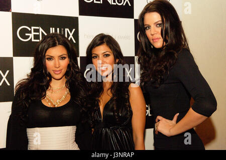 (L-R) Reality TV Stars Kim Kardashian, Kourtney Kardashian and Khloe Kardashian arrives for the launch of Heavenly Sinful Jewels and GENLUX Magazine party on the rooftop at the Luxe Hotel in Beverly Hills. Stock Photo