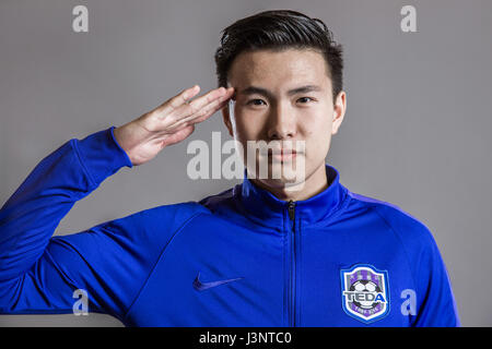 Portrait of Chinese soccer player Li Zheng of Tianjin TEDA F.C. for the 2017 Chinese Football Association Super League, in Tianjin, China, 26 February 2017. Stock Photo