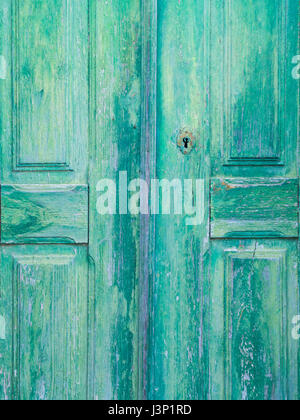 Old green wooden door in Obidos, Portugal Stock Photo