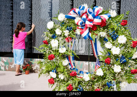 Miami Florida,Bayfront Park,The Moving Wall,Vietnam Veterans Memorial,replica,military,war,girl girls,youngster,female kids children pointing,honor,na Stock Photo