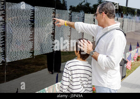 Miami Florida,Bayfront Park,The Moving Wall,Vietnam Veterans Memorial,replica,military,war,man men male,boy boys,kid kids child children youngster,fat Stock Photo