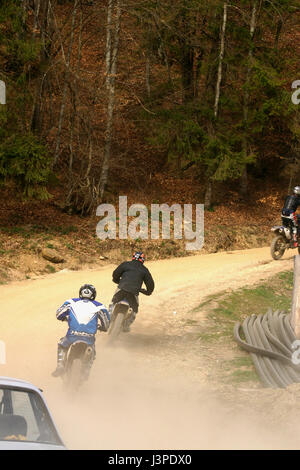 Motorcyclists on cross country competition Stock Photo