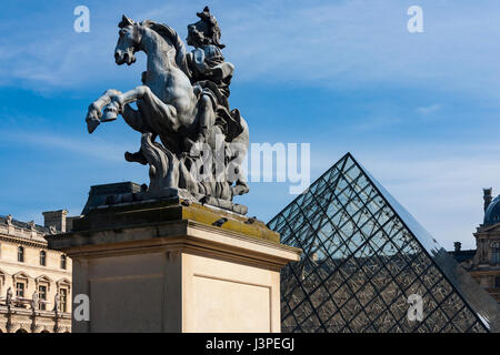 Equestrian statue of king Louis XIV in the courtyard of the Louvre Museum, Paris, France  Purchase from Aprishot: http://bit.ly/1kFOzoM Stock Photo