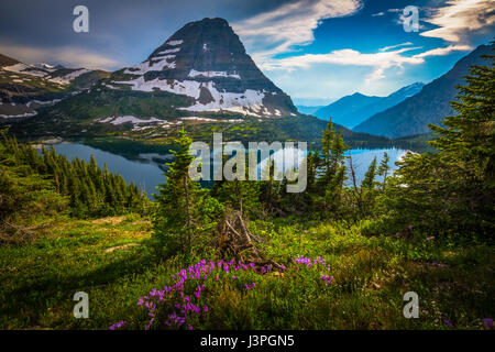 Hidden Lake is located in Glacier National Park, in the U. S. state of Montana. Hidden Lake is surrounded by numerous peaks including Bearhat Mountain Stock Photo