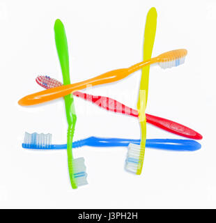 colorful toothbrush disheveled on withe background Stock Photo