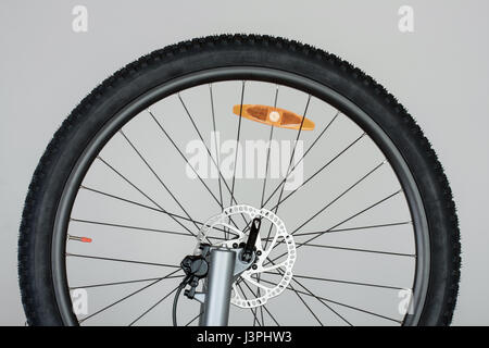 Part of front wheel of mtb bike with hydraulic disc brakes. Stock Photo