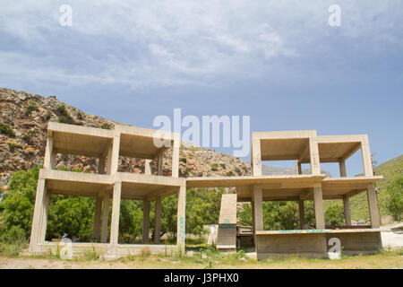 Unfinished illegal building, a construction of armoured concrete, on Crete, Greece Stock Photo