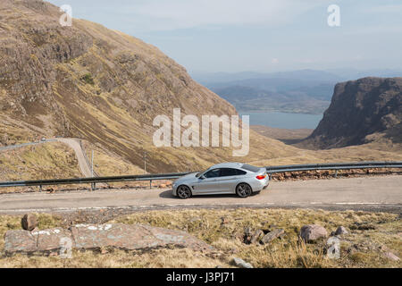 North Coast 500 route - car on Bealach na ba road, Applecross, Highland, Scotland, UK Stock Photo