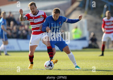 Doncaster's James Coppinger and Hartlepool's Nicky Featherstone battle for the ball during the Sky Bet League Two match at the Northern Gas and power Stadium, Hartlepool.