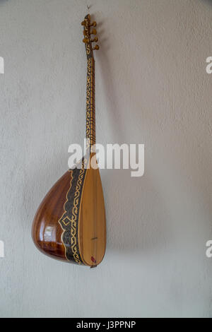Baglama (turkish musical instrument) on the wall Stock Photo