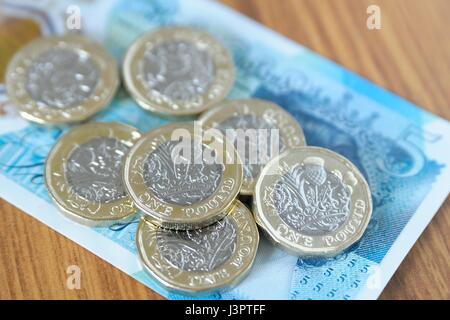 New Pound Coins & Five pound note. Stock Photo