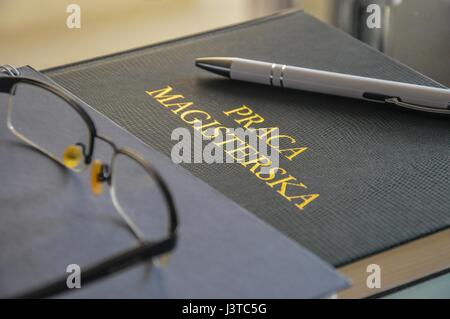 Master thesis printed, the last exam to pass. Stock Photo