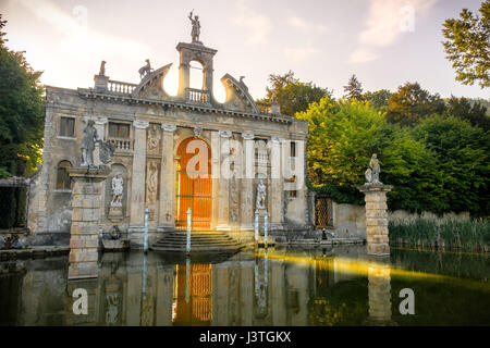 Valsanzibio sun rays pass through the gates of Valsanzibio garden on water pond entrance of Villa Barbarigo Stock Photo