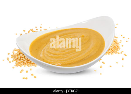 Mustard sauce and seeds isolated on white Stock Photo