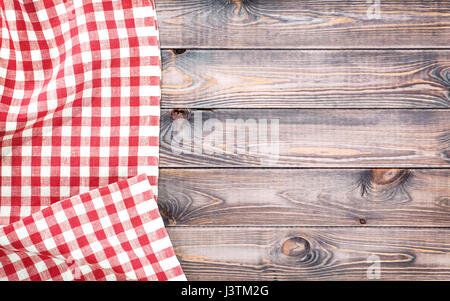 Red checkered tablecloth on light wooden table with, top view with copy space Stock Photo