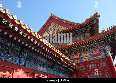 Tiled roof and facade decorated with a Chinese pattern. Palace in The Forbidden City, Beijing, China, February 23, 2016. Stock Photo