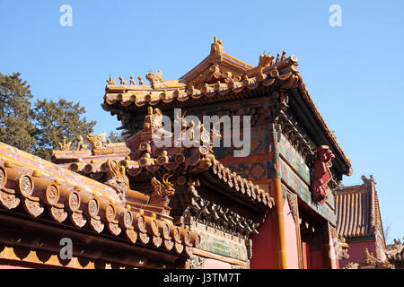 Tiled roof and facade decorated with a Chinese pattern. Palace in The Forbidden City, Beijing, China, February 23, 2016. Stock Photo