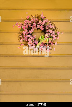 Pink flower wreath decorated for easter with bunny Stock Photo