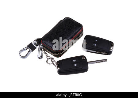 Remote car keys and leather case isolated on white background. Stock Photo