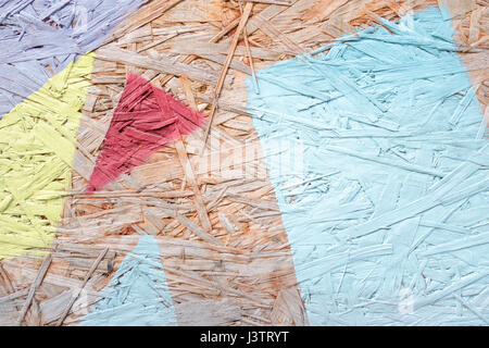 Green, yellow, blue painted wood chipboard texture background. Close up Stock Photo