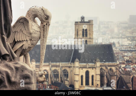 View from Tower of Cathedrale Notre-Dame de Paris on St-Gervais-et-St-Protais Church of Paris. Statue of stork. France Stock Photo