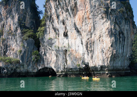 Tourists in inflatble canoes exploring Koh Hong, hang Nga Bay, huket, Thailand Stock Photo