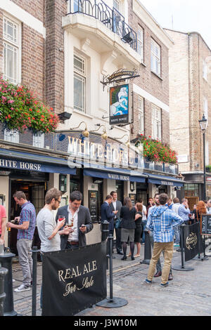 people drinking outside the White Horse public house, Great Marlborough Street Stock Photo