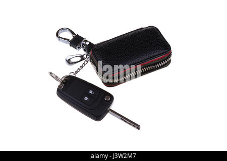 Remote car key and leather case isolated on white background. Stock Photo