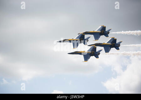 BELLE CHASSE, La. – The Blue Angels, a demonstration team with the U.S. Navy performs aerial acrobatics during the 2017 New Orleans Air Show at Naval Air Station Joint Service Base New Orleans, April 21, 2017.  During their aerobatic demonstration, the Blues fly six F/A-18 Hornet aircraft, split into the Diamond Formation (Blue Angels 1 through 4) and the Lead and Opposing Solos (Blue Angels 5 and 6).  (U.S. Marine Corps photo by Pfc. Niles Lee) Stock Photo