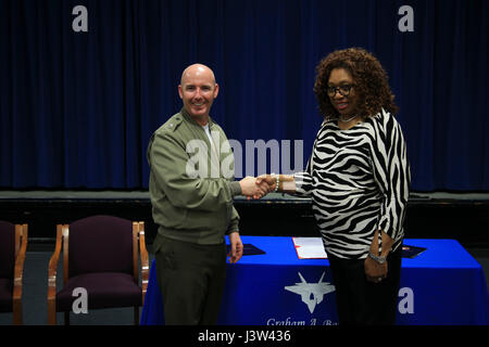 Marilyn Brown, Principal of Graham A. Barden Elementary School, signs a ...