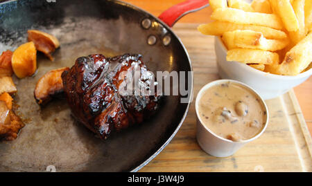 Beef fillet, chips and peppercorn sauce Stock Photo