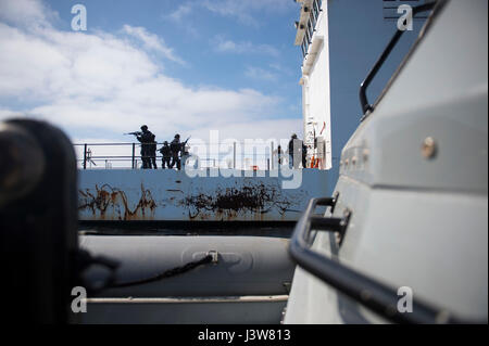 Sailors from the VBSS team of USS Pearl Harbor conducted a boarding drill on a training vessel as part of the America ARG and 15th MEU Composite Unit Training Exercise off Southern California. Stock Photo