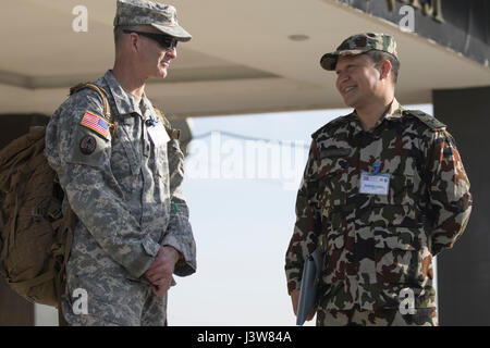 U.S. Army National Guard Lt. Col. Steven Wilson, Mongolian Armed Forces advisor, speaks with Nepalese Army Lt. Col. Suresh Hamal May 3, 2017, in Dalanzadgad, Mongolia, during Gobi Wolf 2017. Nepal and six other countries sent delegates to the exercise. GW 17 is hosted by the Mongolia National Emergency Management Agency and Mongolian Armed Forces as part of the United States Army Pacific's humanitarian assistance and disaster relief 'Pacific Resilience' series. (U.S. Army photo by Sgt. David Bedard) Stock Photo