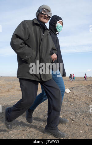 Residents of Dalanzadgad, Mongolia, evacuate to collection centers May 4, 2017, in response to a simulated earthquake during Gobi Wolf 2017. GW 17 is hosted by the Mongolian National Emergency Management Agency and Mongolian Armed Forces as part of the United States Army Pacific's humanitarian assistance and disaster relief 'Pacific Resilience' series. (U.S. Army photo by Sgt. David Bedard) Stock Photo