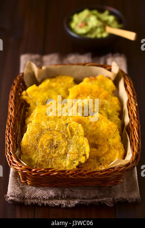 Patacon or toston, fried and flattened pieces of green plantains, a traditional snack or accompaniment in the Caribbean Stock Photo