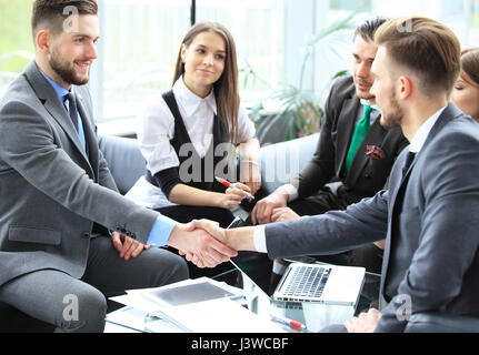 Business people shaking hands, finishing up a meeting. Stock Photo