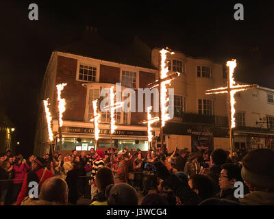 Lewes, England - 5 November 2016: Dark and crowded streets of Lewes for the fire parade of the yearly celebration of the Bonfire night festivities. Stock Photo