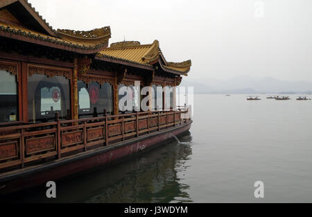 Traditional boat restaurant at the West Lake (Xi hu lake), freshwater lake in Hangzhou. UNESCO World Heritage Site, Hangzhou, Stock Photo