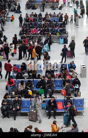 Passengers waiting for the train in the hall. Hangzhou East railway station is one of the largest railway hub in Asia Stock Photo